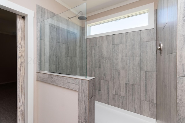 bathroom with tiled shower