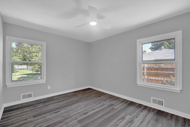 4832 SW 10th Ave, Amarillo, TX 79106 - spare room featuring plenty of natural light, a ceiling fan, wood finished floors, and baseboards