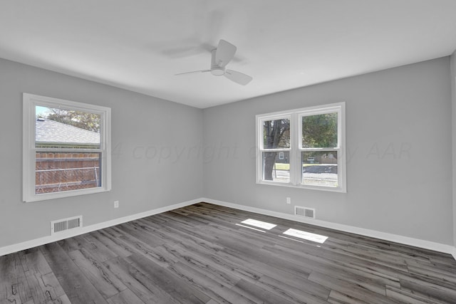 4832 SW 10th Ave, Amarillo, TX 79106 - unfurnished room with ceiling fan, dark wood-style floors, and baseboards