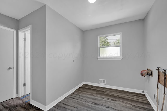 4832 SW 10th Ave, Amarillo, TX 79106 - spare room featuring dark wood-type flooring and baseboards