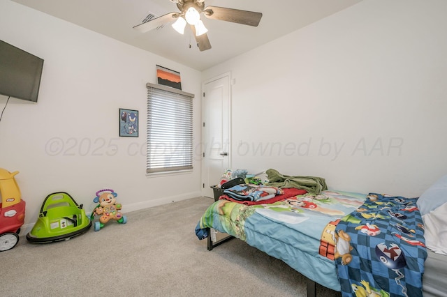 bedroom with a ceiling fan, baseboards, visible vents, and carpet flooring