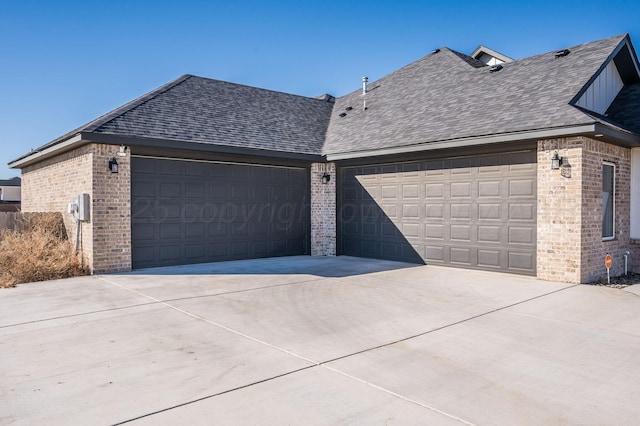 garage with concrete driveway