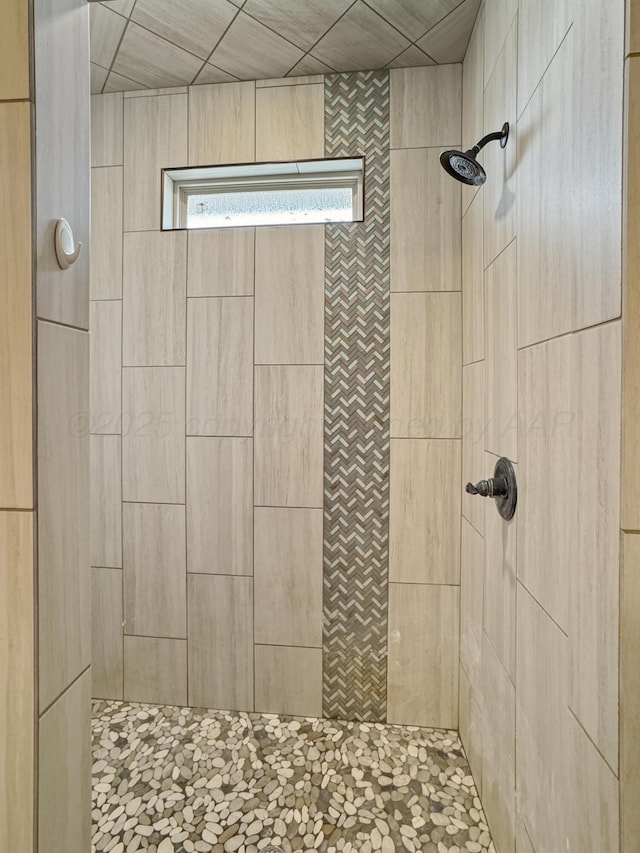 bathroom with a tile shower