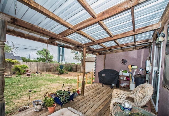 deck with a pergola, area for grilling, and a lawn