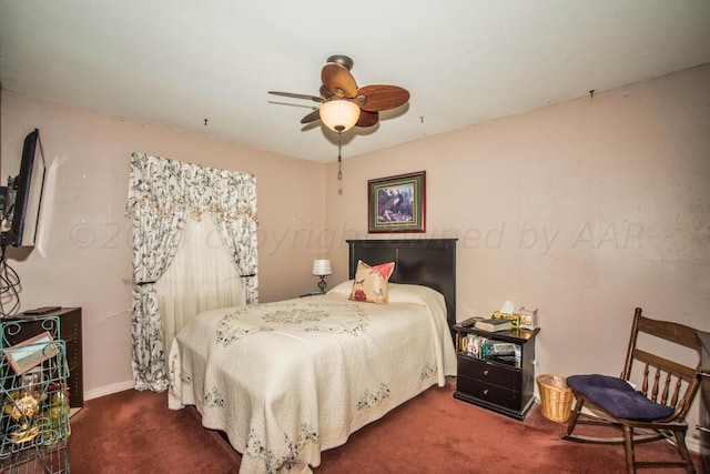 bedroom featuring dark carpet and ceiling fan