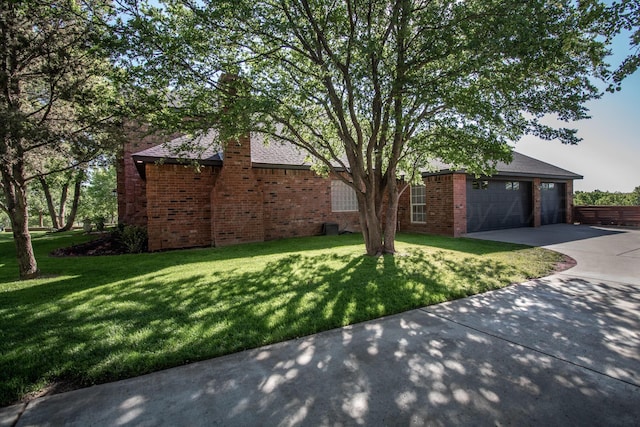2112 Clubview, Amarillo, TX 79124 - view of front of house featuring a front lawn, concrete driveway, and brick siding
