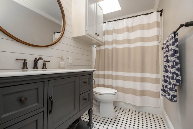 2112 Clubview, Amarillo, TX 79124 - full bath featuring vanity, toilet, wood walls, tile patterned floors, and curtained shower