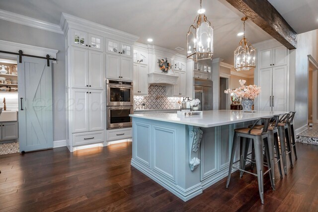2112 Clubview, Amarillo, TX 79124 - kitchen featuring stainless steel appliances, light countertops, decorative backsplash, a chandelier, and white cabinets