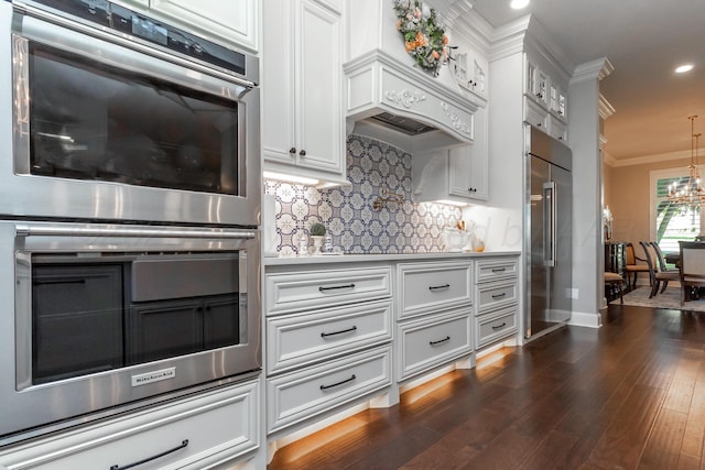 2112 Clubview, Amarillo, TX 79124 - kitchen featuring stainless steel appliances, ornamental molding, decorative backsplash, dark wood-style flooring, and recessed lighting