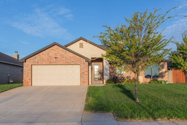 view of front of property with a garage and a front yard