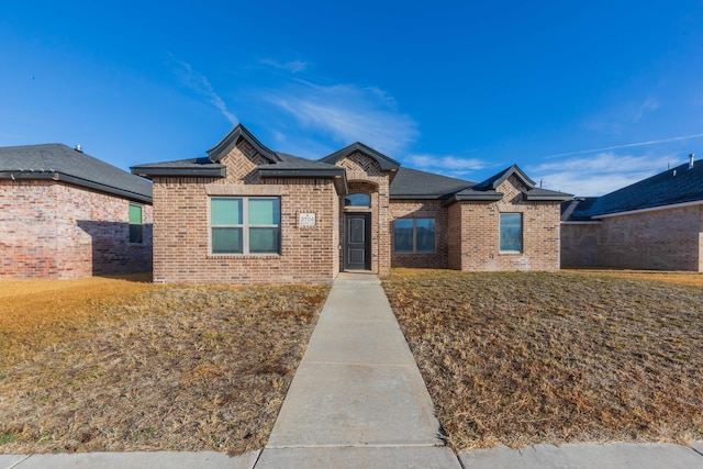 view of front of home with a front yard