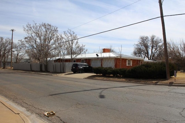 view of street featuring curbs and sidewalks