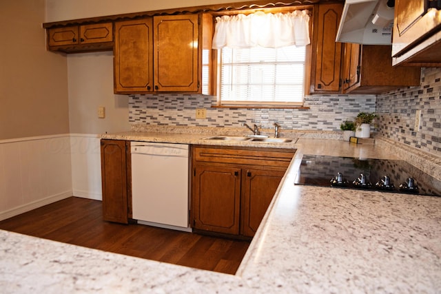 220 Hickory St, Hereford, TX 79045 - kitchen featuring white dishwasher, ventilation hood, black electric cooktop, light countertops, and a wainscoted wall