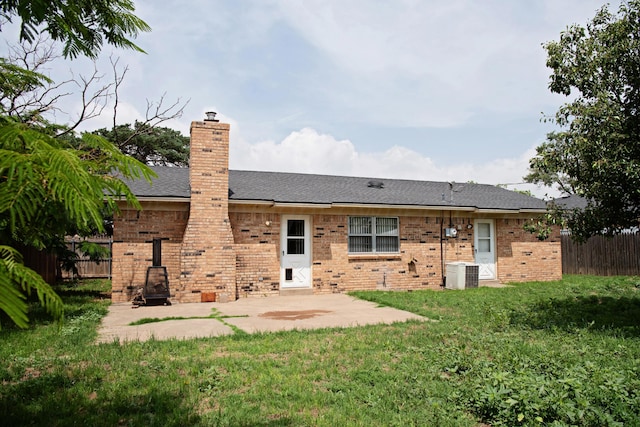 220 Hickory St, Hereford, TX 79045 - rear view of property featuring brick siding, a patio, a chimney, and roof with shingles