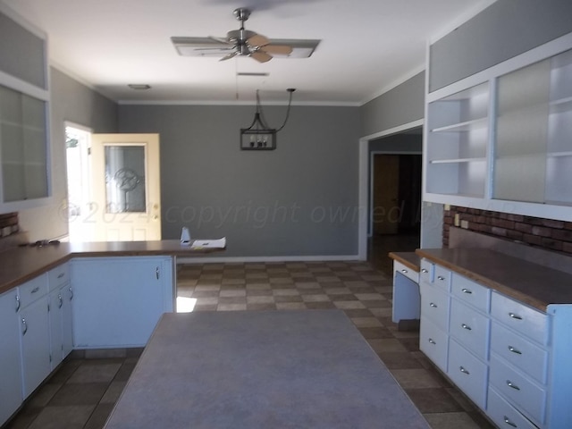 kitchen with ceiling fan, white cabinetry, decorative backsplash, and ornamental molding