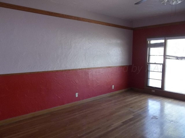 empty room with hardwood / wood-style flooring