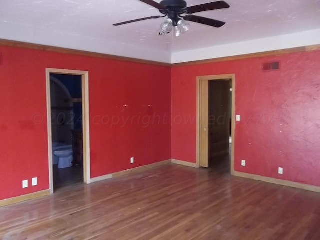 spare room with wood-type flooring and ceiling fan