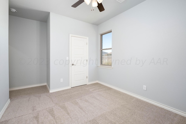 unfurnished bedroom featuring ceiling fan and light carpet