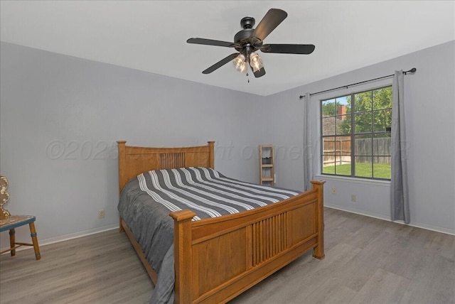 7104 Old Kent Rd, Amarillo, TX 79109 - bedroom featuring light wood finished floors and a ceiling fan