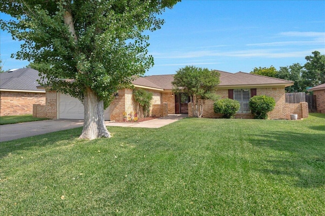 7104 Old Kent Rd, Amarillo, TX 79109 - view of front facade featuring driveway, brick siding, and a garage