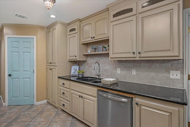 7104 Old Kent Rd, Amarillo, TX 79109 - kitchen featuring cream cabinetry, stainless steel dishwasher, tasteful backsplash, light tile patterned floors, and recessed lighting