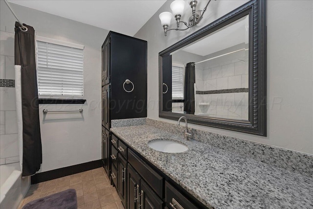 7104 Old Kent Rd, Amarillo, TX 79109 - bathroom featuring vanity, shower / tub combo with curtain, and a chandelier