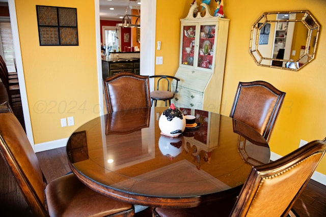 dining area with wood-type flooring