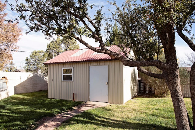 view of outbuilding with a lawn