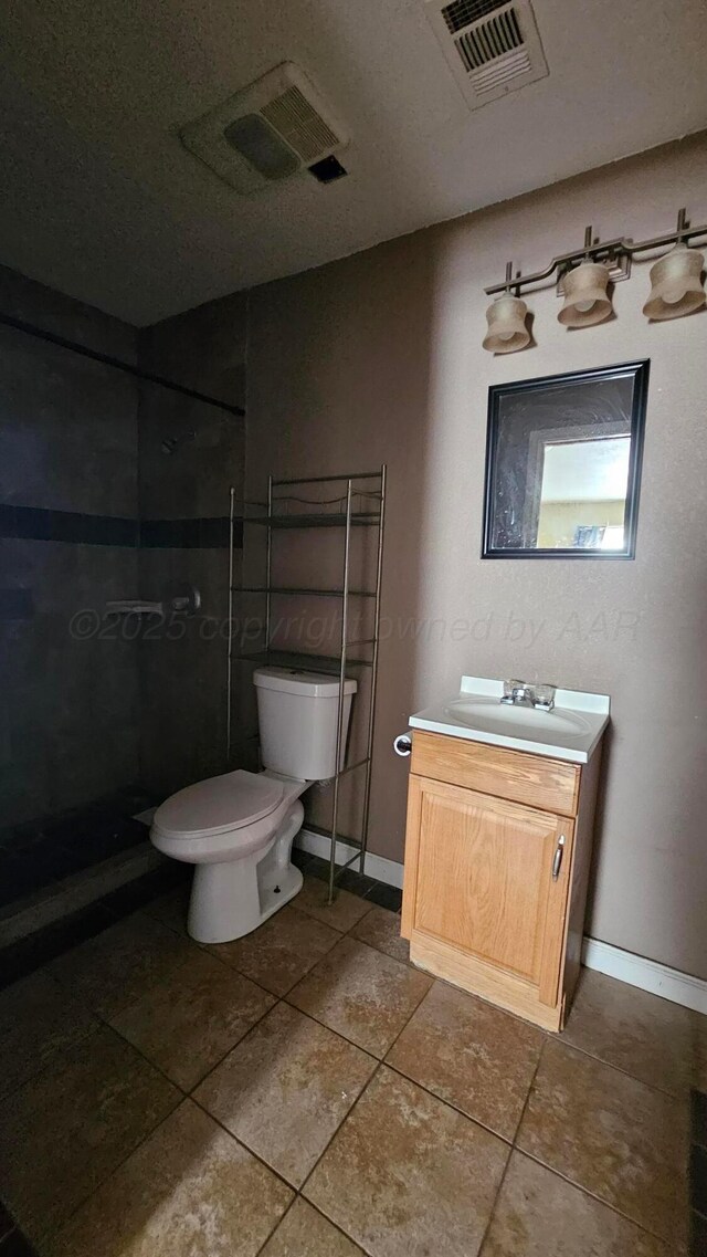 1300 Patton Cir, Borger, TX 79007 - full bathroom featuring vanity, tile patterned flooring, and a tile shower