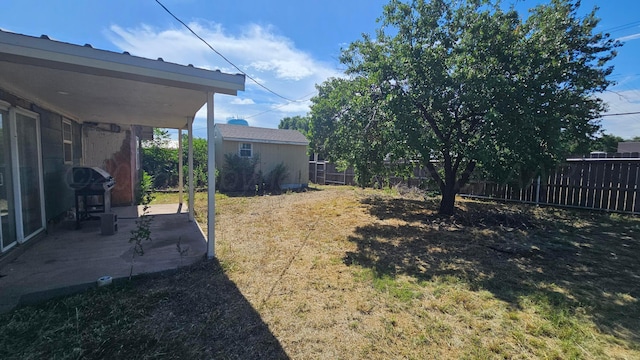 1300 Patton Cir, Borger, TX 79007 - fenced backyard with a patio