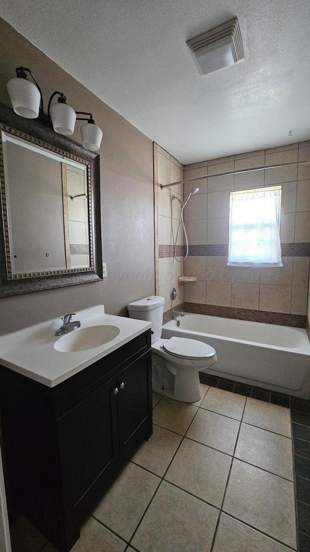 1300 Patton Cir, Borger, TX 79007 - bathroom with a textured ceiling, vanity, tile patterned flooring, and bathtub / shower combination