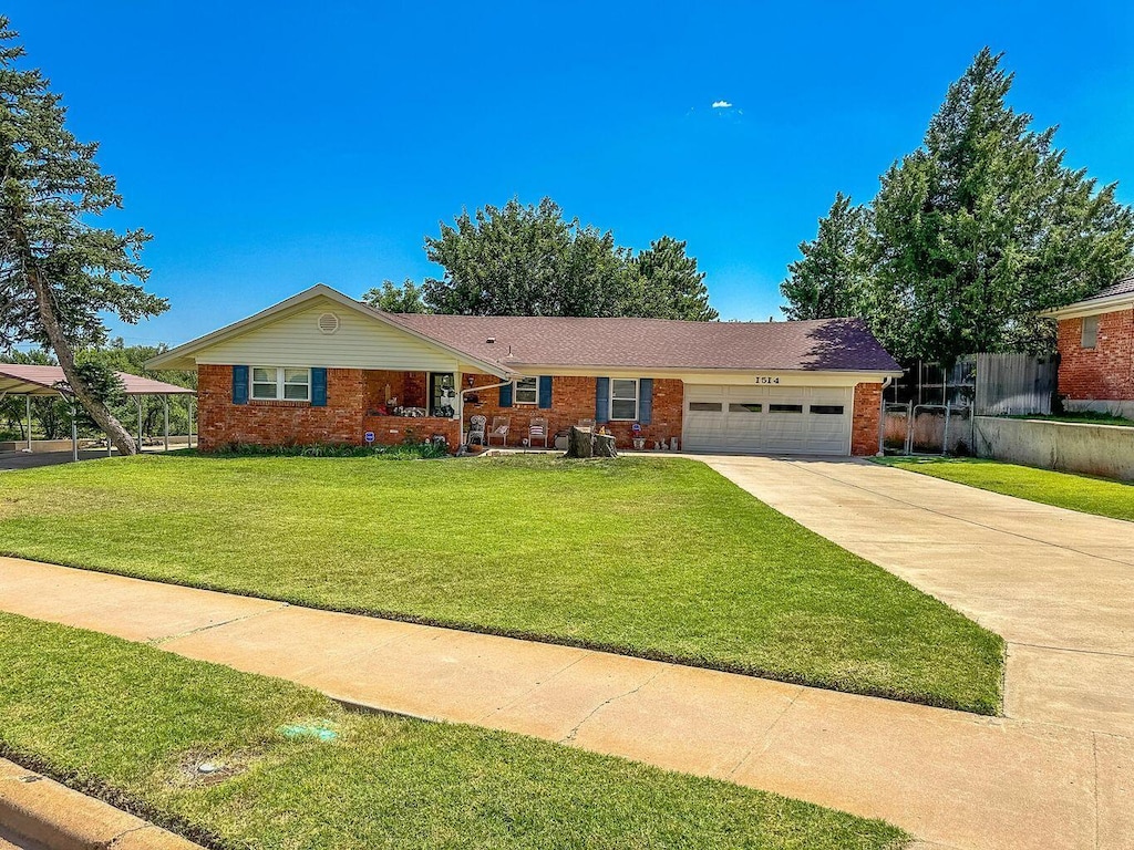 ranch-style home with a garage and a front yard