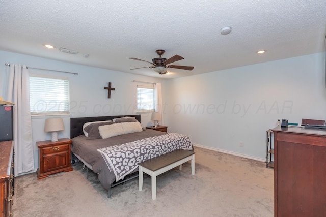 bedroom with light carpet, a textured ceiling, recessed lighting, a ceiling fan, and baseboards