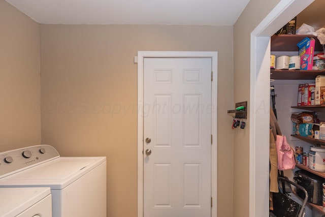 clothes washing area with washer and clothes dryer