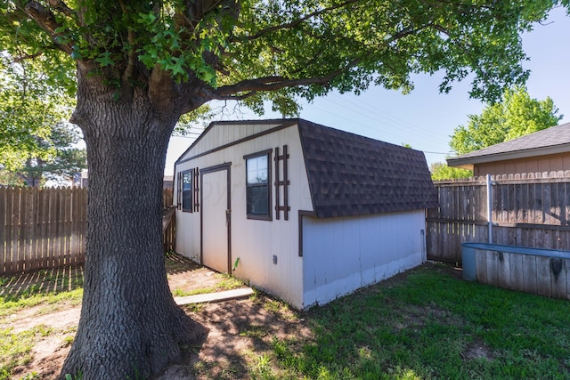 view of shed with a fenced backyard