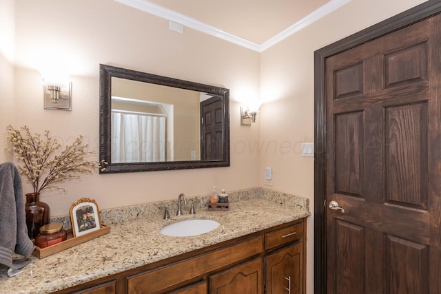 bathroom with vanity and ornamental molding