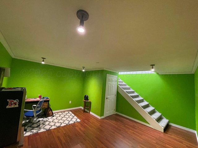 game room featuring crown molding, wood finished floors, and baseboards