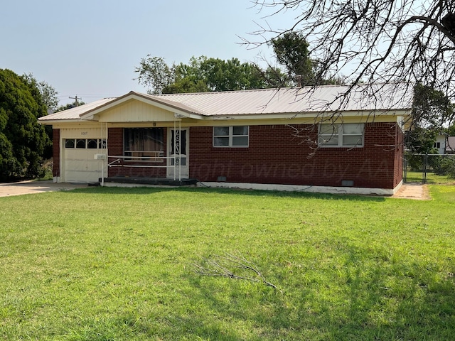 ranch-style home with a front lawn and a garage