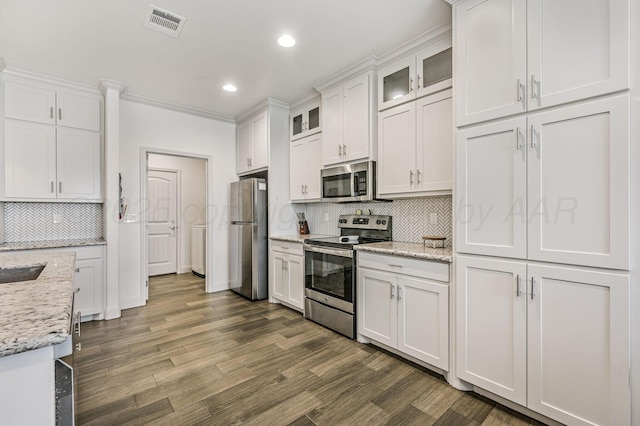 kitchen featuring dark wood-style floors, white cabinetry, stainless steel appliances, and glass insert cabinets