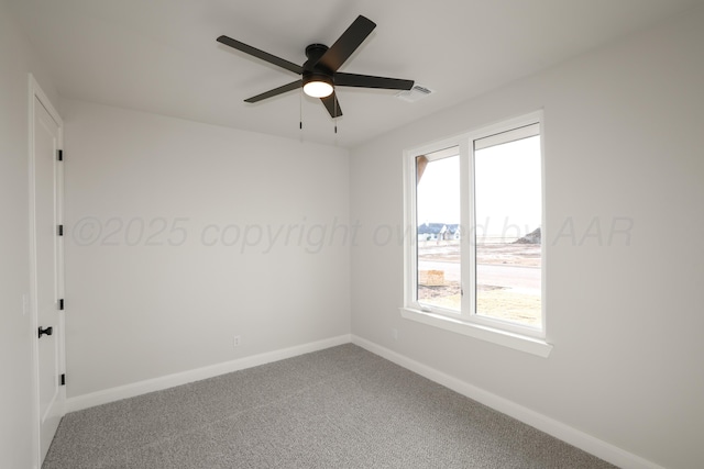 carpeted empty room featuring ceiling fan