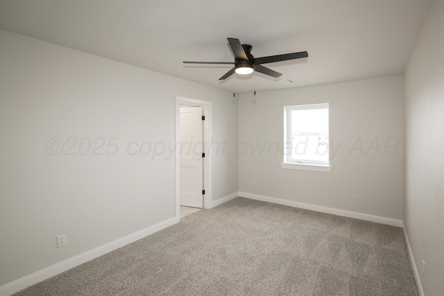 spare room featuring carpet floors and ceiling fan