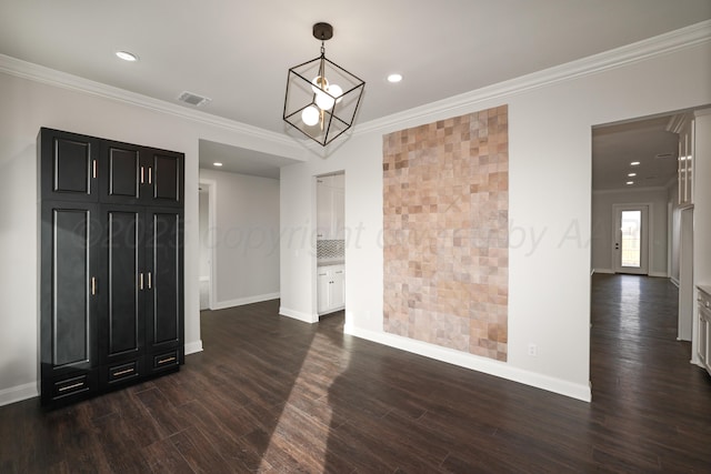 unfurnished room with dark hardwood / wood-style flooring and crown molding