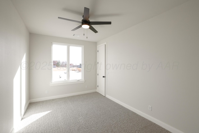 empty room featuring ceiling fan and carpet flooring