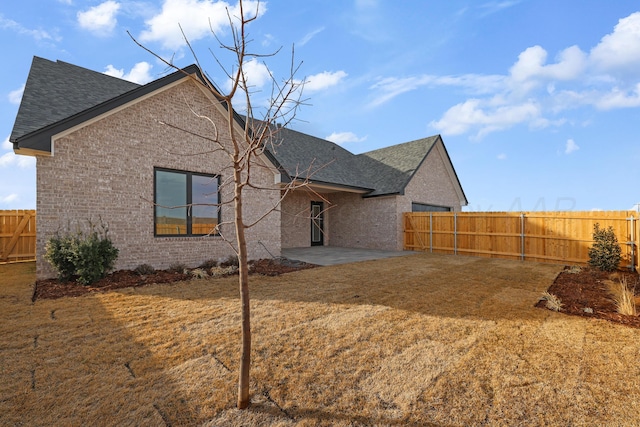 exterior space with a patio and a yard