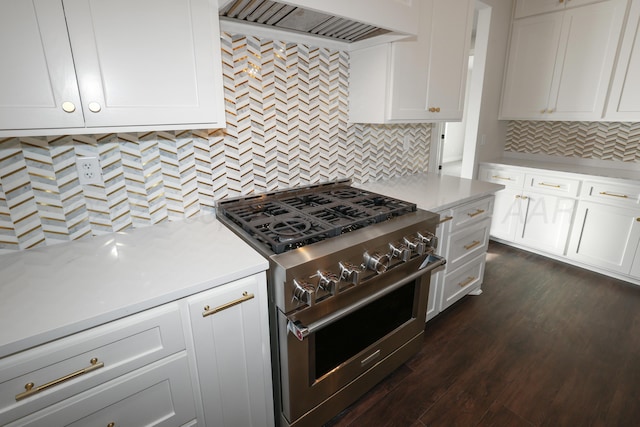 kitchen with white cabinetry, high end stainless steel range, dark wood-type flooring, and custom range hood