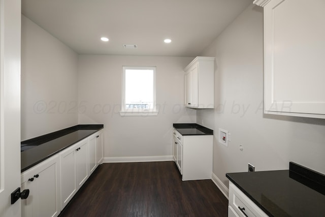 kitchen with white cabinetry and dark hardwood / wood-style floors