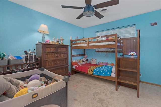 carpeted bedroom featuring baseboards