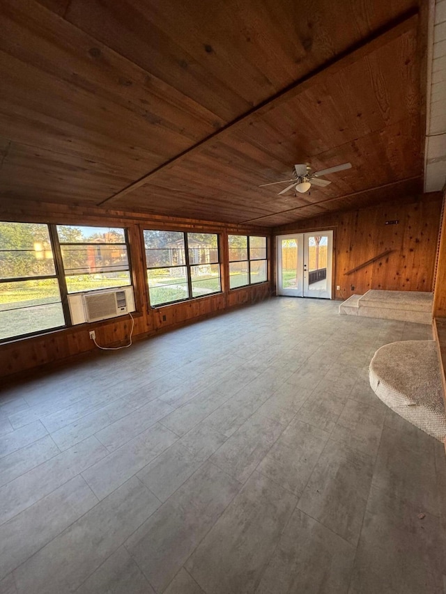 unfurnished sunroom featuring french doors, cooling unit, ceiling fan, and wooden ceiling