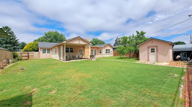 907 Cherry Ave, Dalhart, TX 79022 - rear view of property with stucco siding and a patio
