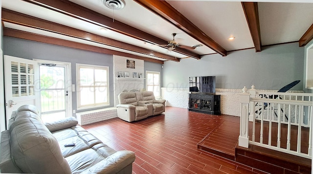 907 Cherry Ave, Dalhart, TX 79022 - living room featuring a fireplace, ceiling fan, beamed ceiling, and wood finished floors